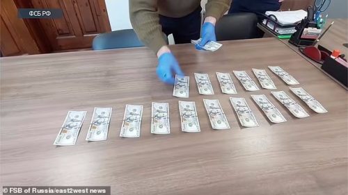 60675353 11046913 Ukrainian spooks footage shows what appears to be dollars piled a 17 1658767871730