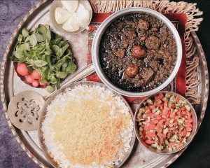 Khoresh Ghormeh Sabzi Persian Herb Stew with salad shirazi onion and sabzi